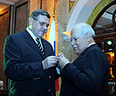 Ambassador Bolotin presenting to Deputy PM Fares the medal